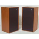 A pair of retro mid-century / 1970’s teak wood cased Wharfdale speakers with fabric grilled facias.