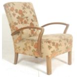 A 1930's Art Deco fireside bentwood armchair in the manner of Heals of London. The armchair with