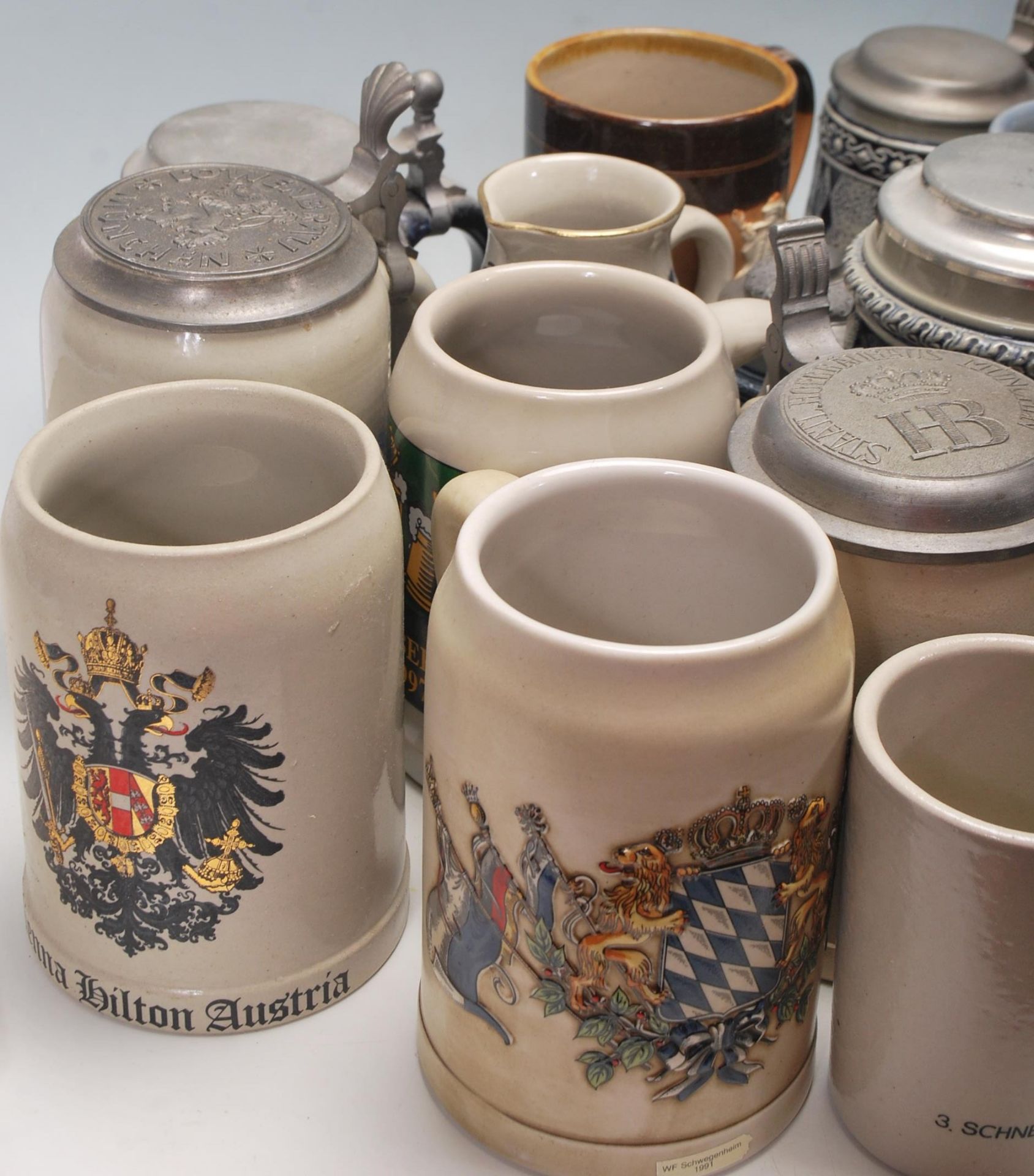 A collection of 20th Century German ceramic stein drinking glasses, each having raised decoration to - Bild 2 aus 10