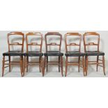 A set of five 19th Century Victorian mahogany dining chairs having a shaped backrest over a