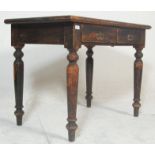 A 19th century Victorian mahogany table / desk, having two central drawers with swing handle