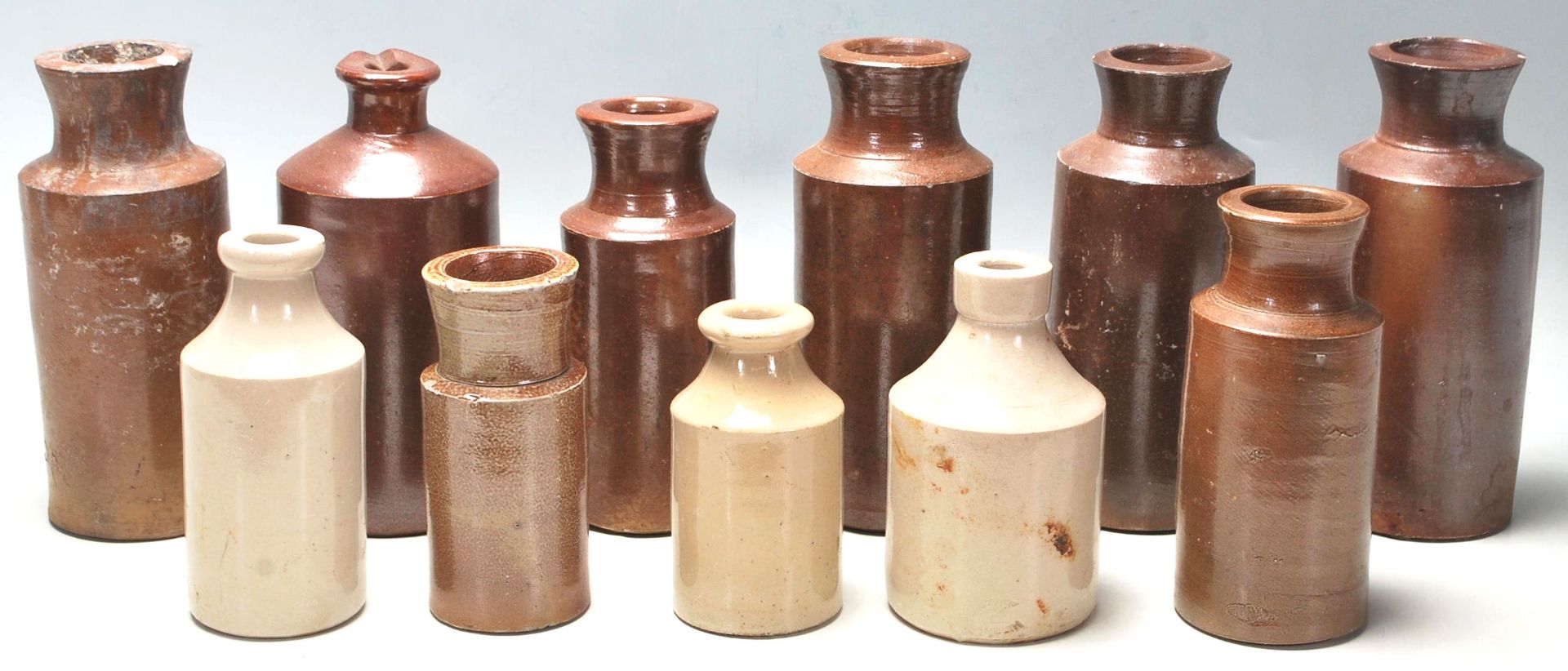 A mixed collection of early 20th Century Doulton Lambeth style stoneware flagons / drinking vessels.