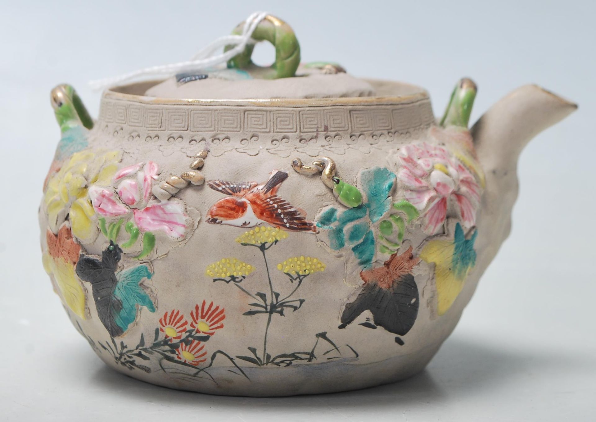 A antique Chinese believed 19th century clay teapot with coloured raised natural motif. Marked - Bild 2 aus 5