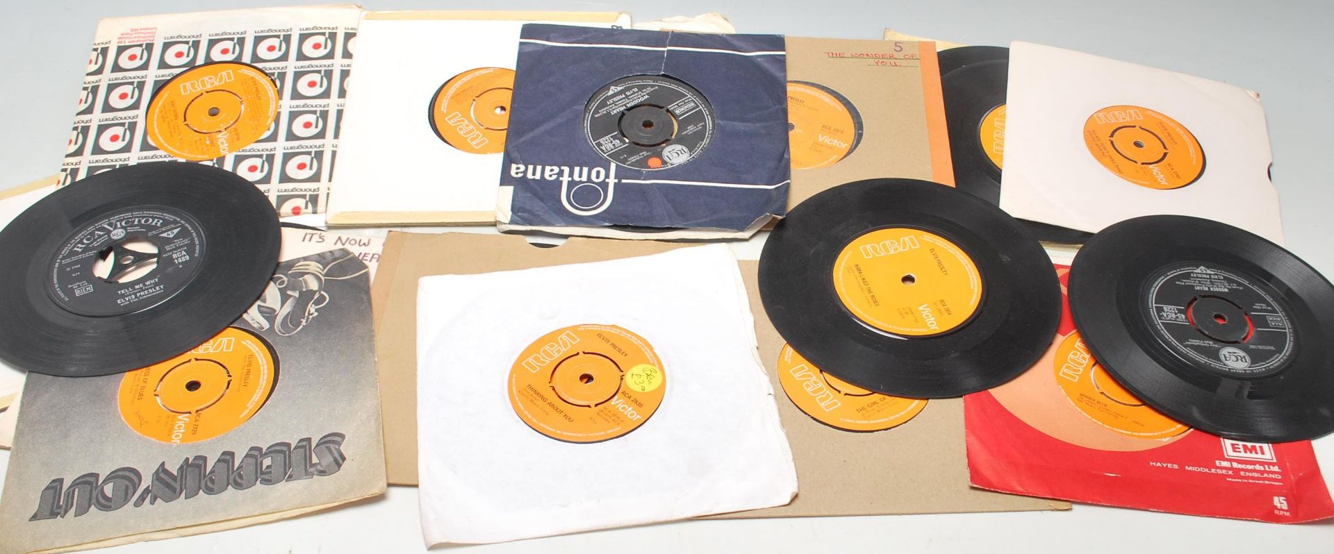 A collection of 20 vinyl 45 records by Elvis Presley to include Are You Lonesome Tonight, Crying