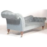 A Victorian 19th century double scroll end chesterfield sofa settee / chaise longue. Raised on