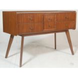 A retro mid century, Danish influenced walnut chest of drawers. Raised on tapering angular legs with