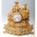 A early 20th century French brass spelter mantel clock having the typical french decoration to the