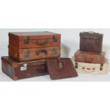A collection of retro vintage circa 1950s mid century leather suitcases / satchels of various sizes.