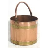 A late 19th Century early 20th Century Victorian copper and brass cylindrical coal bucket scuttle