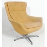 A vintage mid century retro Danish inspired egg chair  - easy swivel armchair. The chair being