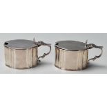 A pair of early 20th Century silver hallmarked table cruets / sauce / mustard pots of oval form each