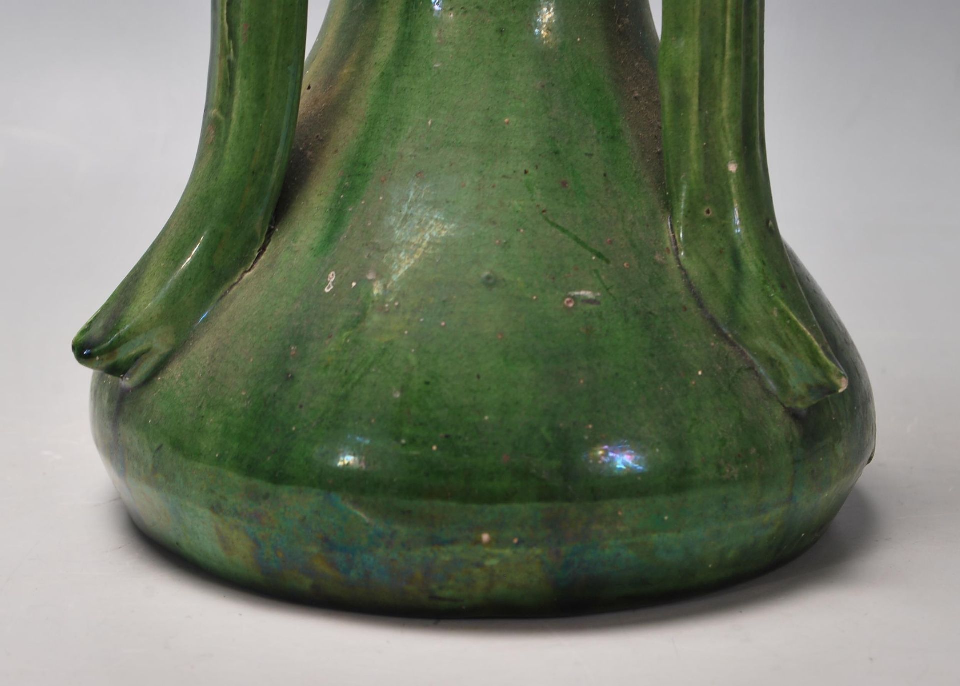 A vintage 20th Century French studio pottery vase having three curved handles to the top with a - Bild 4 aus 6