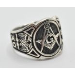 A stamped 925 silver gentleman ring having the masonic symbol centre with number 32, eagle, and