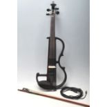 A cased Hidersine 4/4 full sized electric violin complete with the case and bow. Makers label