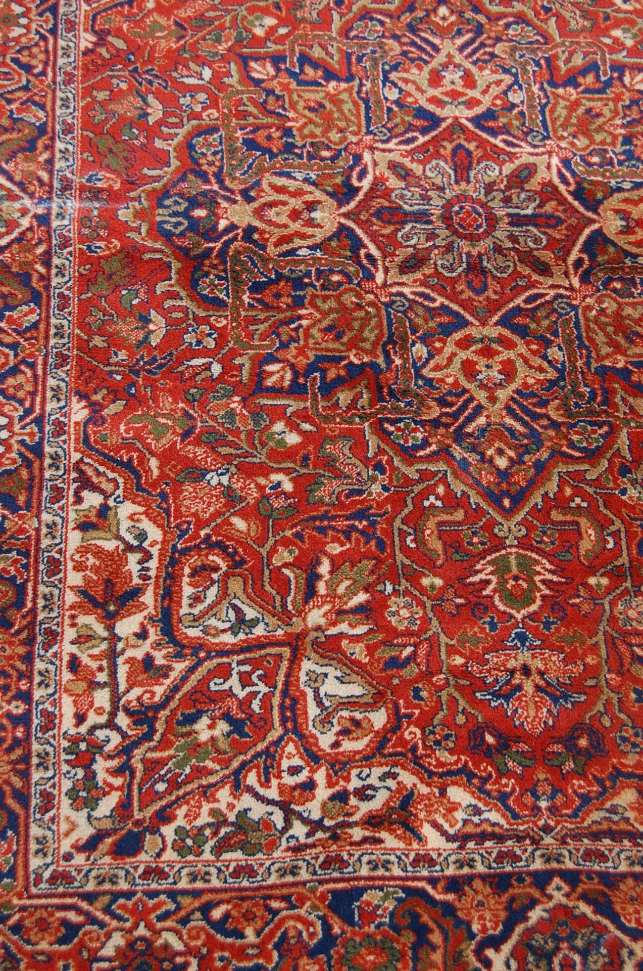 A 20th century Persian / Islamic Mashad Iranian floor rug having a central red ground with single - Image 2 of 4