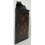 An 18th / 19th century black laquer Chinese chinoiserie decorated corner cabinet. The black ebonised