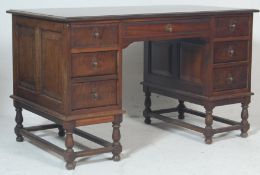 A 1920's Jacobean oak revival twin pedestal partners desk. Raised on turned legs with peripheral