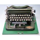 An vintage early 20th century typewriter by Imperial having a green enamel colourway with gilt