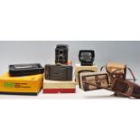 A group of vintage early 20th century photograph cameras to include brown box cameras and  folding