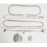A group of vintage silver necklaces to include a three tone plaited flat link necklace, a flat