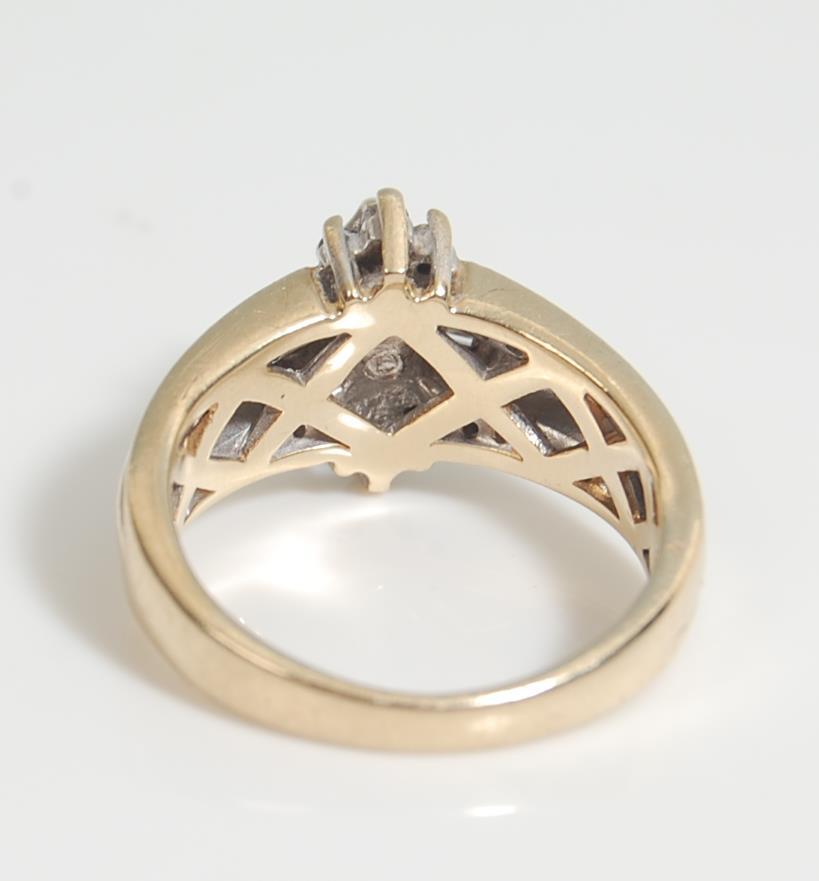 A 14 ct gold and diamond ladies ring having a central marquise cut diamond with further round and - Image 4 of 7