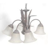 A 20th century antique style toleware chandelier - electrolier. The bronzed effect metal with leaf