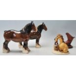 A collection of ceramic horses to include a Royal Doulton shire horse having a dark brown