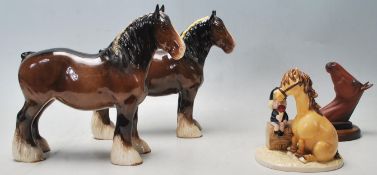 A collection of ceramic horses to include a Royal Doulton shire horse having a dark brown