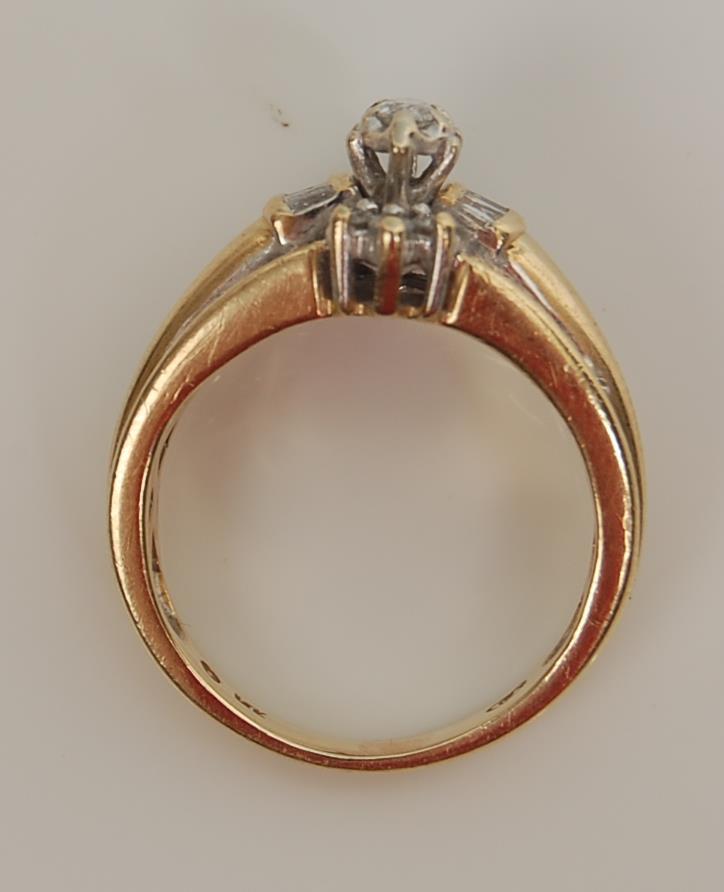 A 14 ct gold and diamond ladies ring having a central marquise cut diamond with further round and - Image 7 of 7