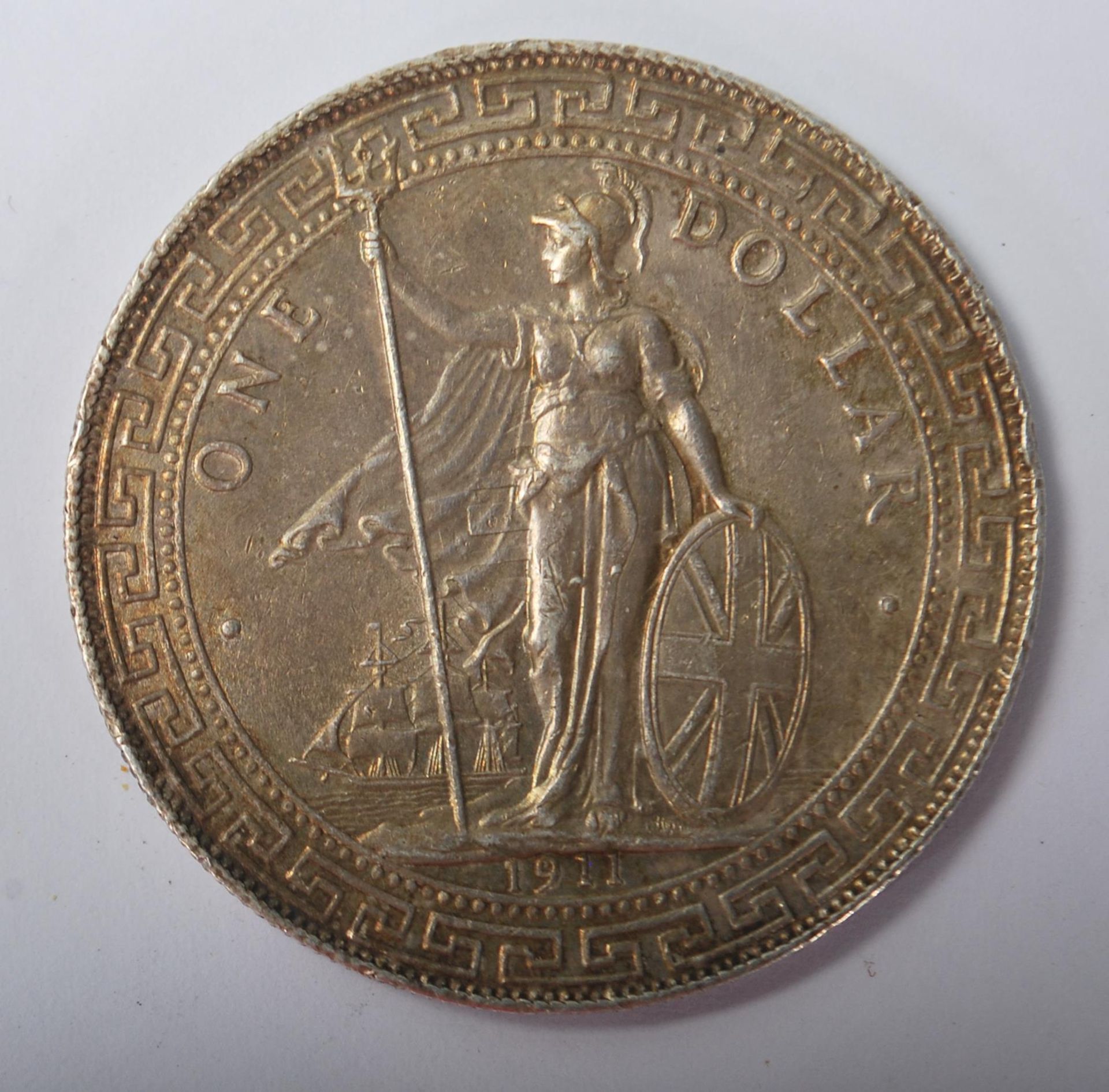 A 1911 One Dollar United Kingdon Trade Dollar being Bombay Mint stamped dating 1911 with Brittania - Bild 6 aus 6