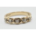 A hallmarked 9ct gold ring having a chain link design set with round cut diamonds. Hallmarked
