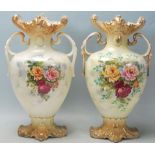 A pair of Victorian 19th century Staffordshire twin handled vases. The pottery vases having gilt