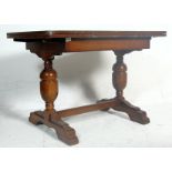 A vintage 1920s early 20th Century oak draw leaf dining table. The table having a panelled oak