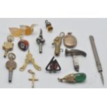 A collection of vintage pendants and related items to include a Chinese green stone pendant set with