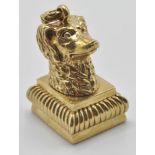 A contemporary gold plated letter seal in the form of a dogs head with swing ring atop. Measures: