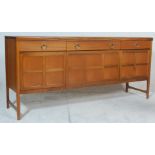 A vintage 20th Century 1970's retro Nathan Long John teak wood sideboard credenza raised on shaped