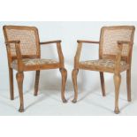 A pair of 20th century carver chairs by P.E. GANE Ltd house furniture, College Green, Bristol.