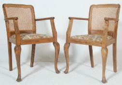 A pair of 20th century carver chairs by P.E. GANE Ltd house furniture, College Green, Bristol.