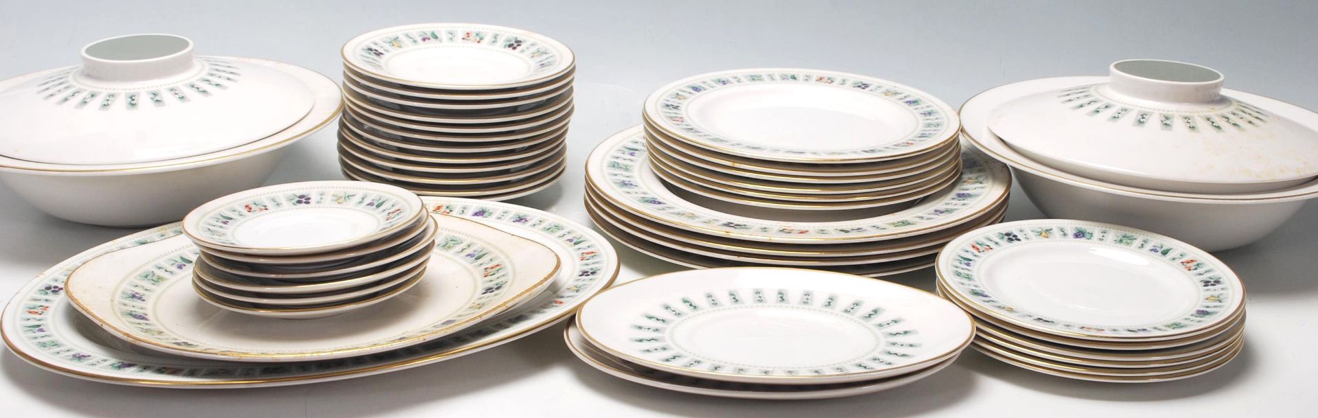 A large late 20th Century fine bone china dinner service by Royal Doulton in the Tapestry pattern