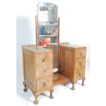 A 1930's Art Deco walnut drop centre pedestal dressing table. Raised on cabriole legs with claw