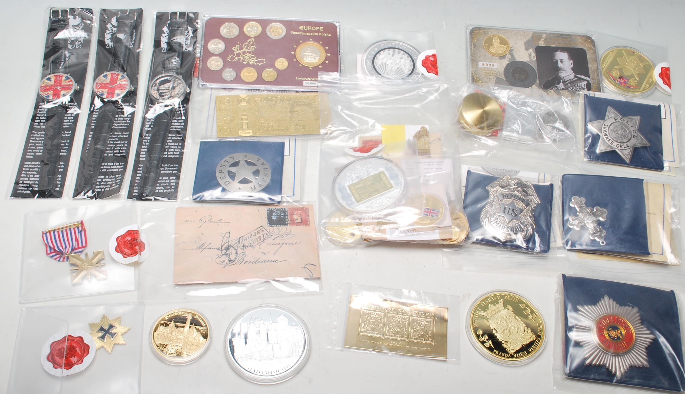 COLLECTION OF COMMEMORATIVE MEDALLIONS AND INGOTS