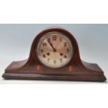 An Edwardian early 20th Century mahogany inlaid Napoleon's hat mantel clock by Baldwin & Gillett.