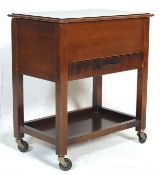 A 1920’s antique oak sewing box with hinged top an