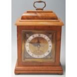 An Edwardian early 20th Century oak cased Elliot mantel clock, retailed by Garrard & Co Ltd,