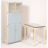 A retro vintage mid century 1950s kitchen cabinet and table set by County in a blue and white