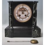 An early 20th Century green veined marble and black slate mantle clock having a chamfered top over a