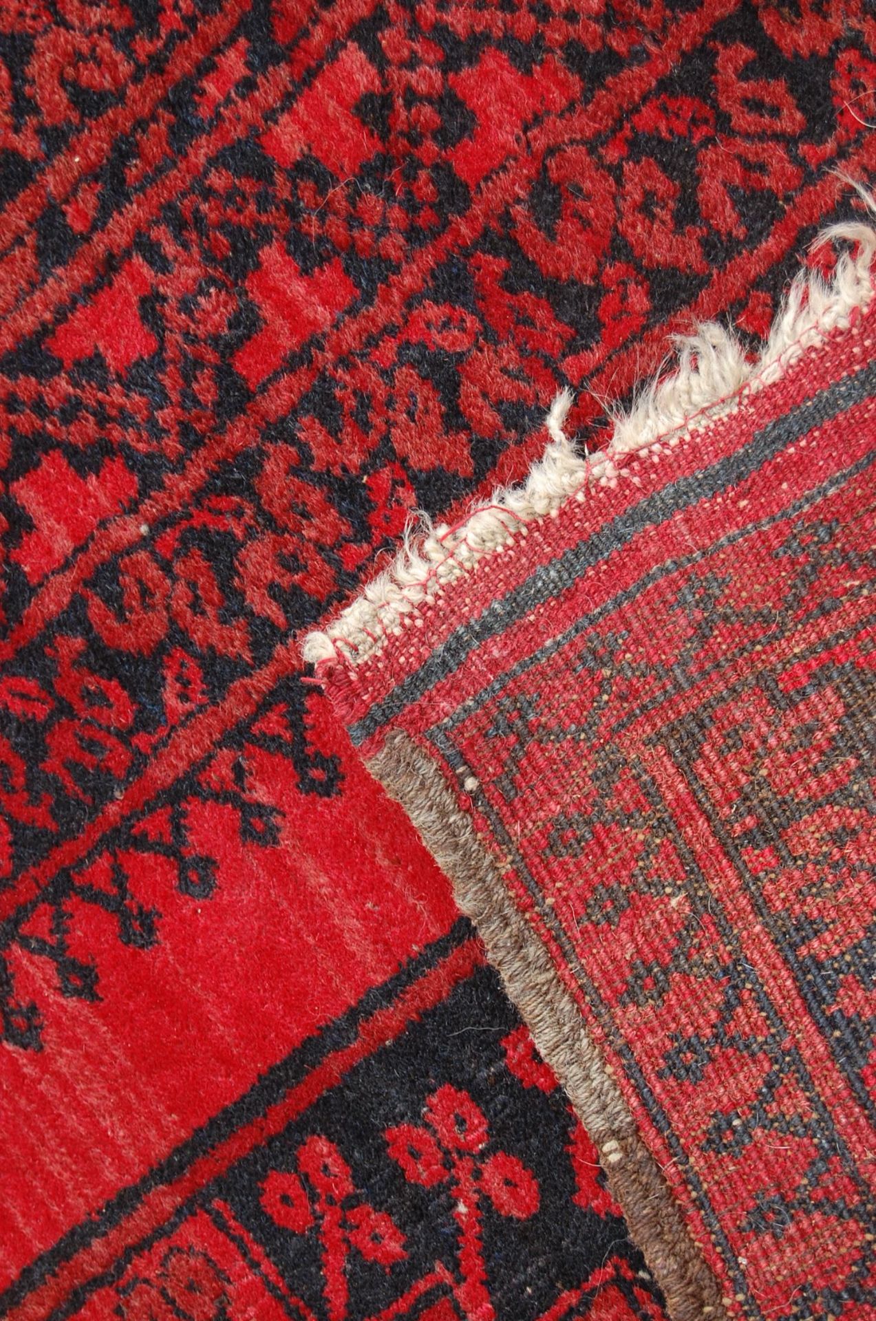 A pair of Islamic / Persian carpet rugs comprising of a red and black carpet having three - Image 5 of 9