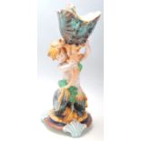 A fine quality 19th century Wedgwood majolica plinth in the form of a mermaid holding a