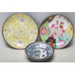 A collection of three mid 20th century Chinese pewter and ceramic plates. The collection comprises