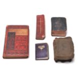 A COLLECTION OF ANTIQUE LEATHER BAND MINIATURE BOOKS